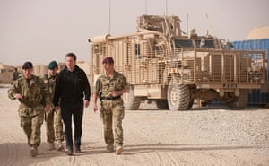 Cameron in Afghanistan : David Cameron walks past a Mastiff armoured vehicle