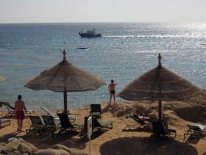 Egypt shark attack: Tourists sunbathe in Sharm el-Sheikh