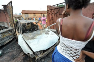 Ivory Coast:  burnt cars in front of the house supporter of President Laurent Gbagbo