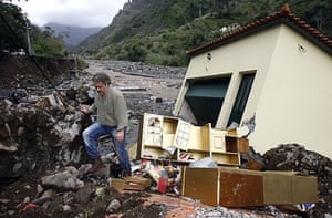 madeira: A man walks out of his destroyed house in Ribeira Brava, Madeira