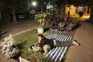 People try to rest on the streets at Santiago, Chile