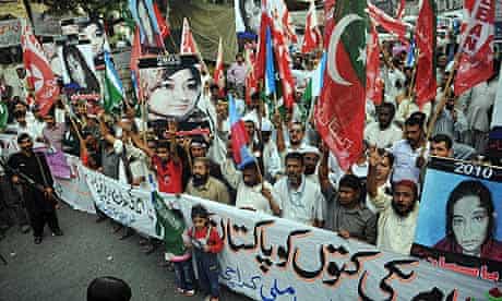 Pakistani activists protest against the conviction of Aafia Siddiqui during a rally in Karachi