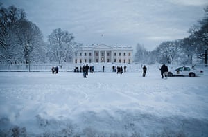 Washington in the snow: People stand on the Mall, outside the White House