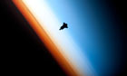 Earth's orbit: The silhouette of the space shuttle Endeavour as it approaches the Space Station