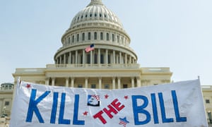 Supporters of the Tea Party movement hold a sign outside the US Capitol