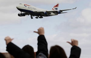 BA Strike: Protestors on the picket line gesture as a British Airways plane