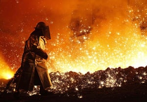 24 hours in pictures: Salzgitter, Germany: A worker controls the cast at a blast furnace