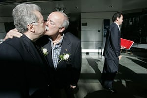 Gay weddings: Tom and Ralph Colucci-Massotti kiss after their civil union at Stamford