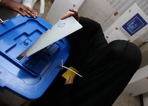 Elections in Iraq: A woman casts her ballot at a polling station in Baghdad's Karada discrit