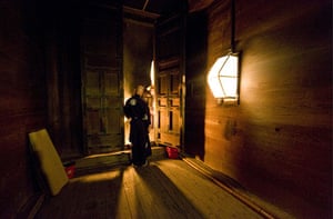 24 hours in pictures: Nara, Japan: A Buddhist monk guards the entrance to the Nigatsudo Hall