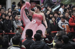 24 hours in pictures: International Women's Day at a shopping mall in Shenyang