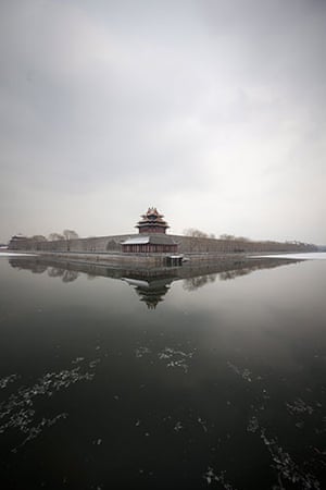 24 hours in pictures: Beijing, China: Snowfall dusts the roofs and moat around the Forbidden City