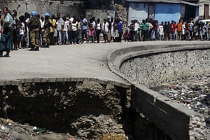 24 hours in pictures: Port-au-Prince, Haiti: People wait to receive aid from the Salvation Army