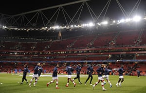 Arsenal v Porto: The Arsenal starting line up warm up on a clear crisp night at the Emirates