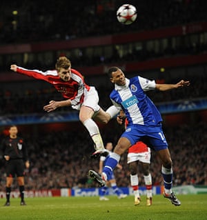 Arsenal v Porto: Bendtner gets in a header ahead of Rolando