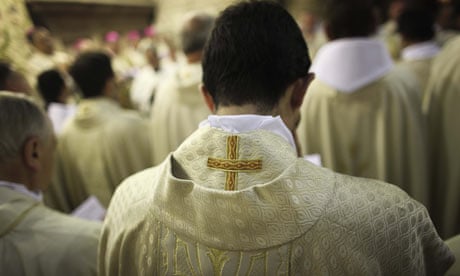 Catholic priests pray