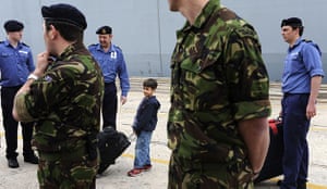 Stranded passengers: A British child waits before boarding HMS Albion 