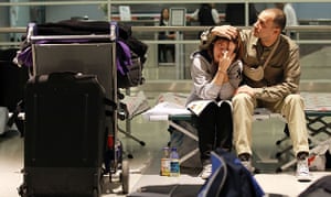 Airspace reopens: Stranded passengers from France hug inside John F Kennedy Airport