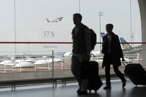 Airspace reopens: Passengers walk with their luggage at Roissy-Charles-de-Gaulle airport