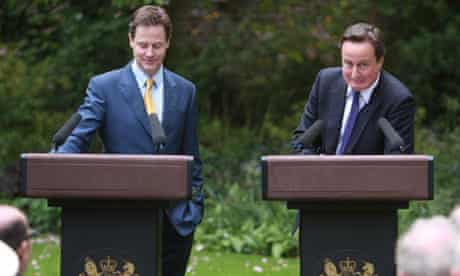 David Cameron looks embarassed after being reminded that he once called Nick Clegg a 'joke'
