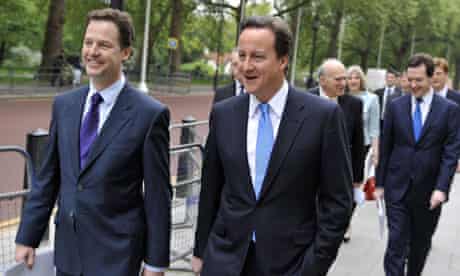 Nick Clegg and David Cameron walk to the Treasury to launch the government's full coalition deal