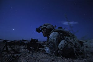 24 Hours in Pics: US Army's Kevin O'Connor lays in wait under cover of darkness in Kandahar