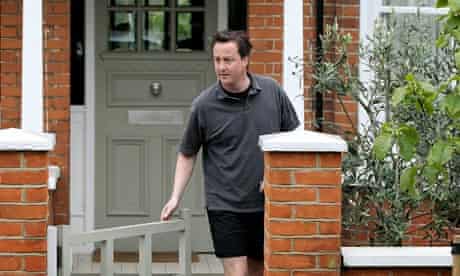 David Cameron leaves his west London home for a run