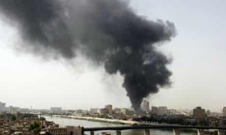 Smoke billows from the scene of one of five explosions that rocked the Iraqi capital Baghdad. 