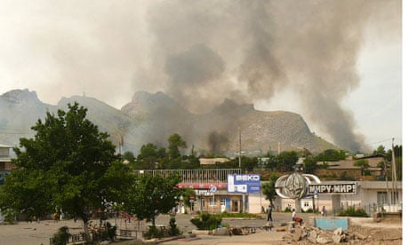 Smoke rises from the residential area of the city of Osh