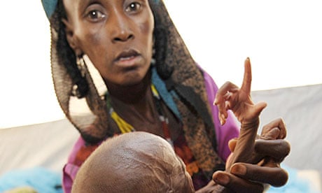 A woman with malnourished baby at an intensive nutritional rehabilitation centre in southern Niger