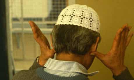 Muslim prisoner saying prayers in prison