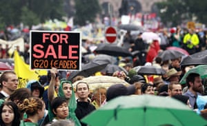 G20 protests: People march in the streets in the rain
