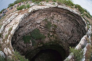 Sinkholes: 2009, Texas, US: The Devil's Sinkhole with people gathered to view bats