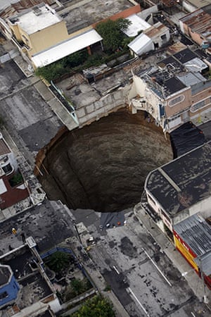 Sinkholes: 2010, Guatemala City, Guatemala: A sinkhole covers a street intersection