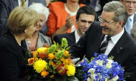 Christian Wulff is congratulated by Angela Merkel