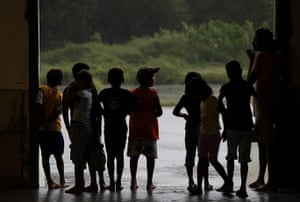 Hurricane Alex: Children evacuees look out from a convention centre being used as a shelter