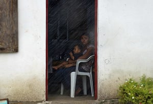 Hurricane Alex: A woman and her son wait to be evacuated from the coast
