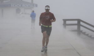Hurricane Alex: John Harris, who is training for a triathlon, runs in the wind and rain