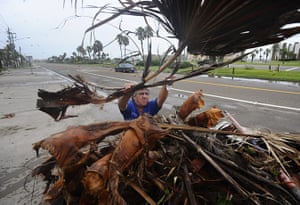 Hurricane Alex: Gilbert Garza, a Code Enforcement Officer cleans up in South Padre Island
