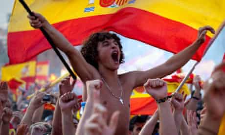Fans celebrate in Barcelona with a rare mass display of Spanish national flags