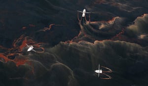 Deepwater Horizon: BP oil spill: Shrimp boats are used to collect oil with booms 