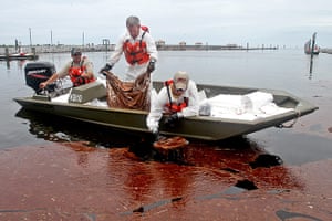 Deepwater Horizon: BP oil spill: Workers skim a large patch of weathered oil 