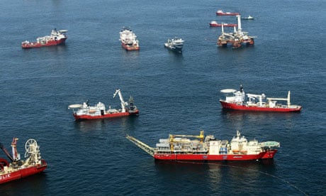 Oil sheen is seen among vessels assisting near the source of the BP oil spill in the Gulf of Mexico