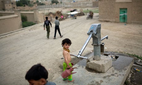 A girl at a communal water pump in Kabul, Afghanistan