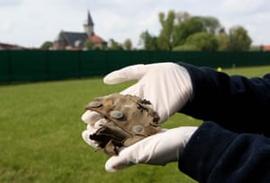 Fromelles: Kate Brady from Oxford Archaeology holds part of a First World War uniform 