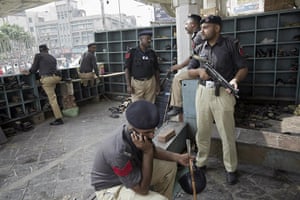 Lahore bombings: Policemen stand guard at the shrine 