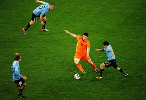 Holland versus Uruguay: Mark Van Bommel shields the ball from Walter Gargano