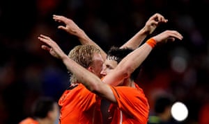 Holland versus Uruguay: Mark Van Bommel and Dirk Kuyt celebrate at full time