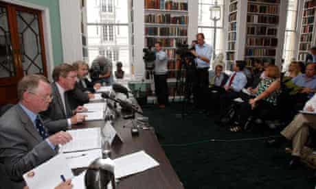 Sir Muir Russell, second left, talks to the media about his report into leaked climate change emails