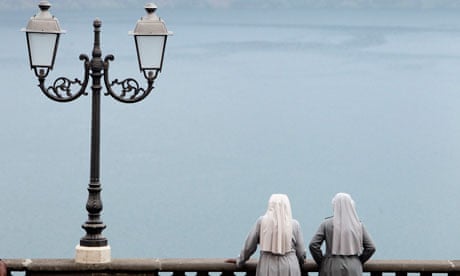 Nuns admire Castel Gandolfo lake in Italy